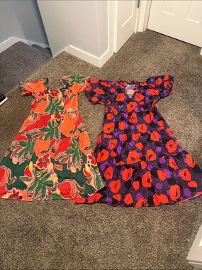 Bundle of dresses- left Capital Sky brand 1x new with tags, right Mud Pie size L